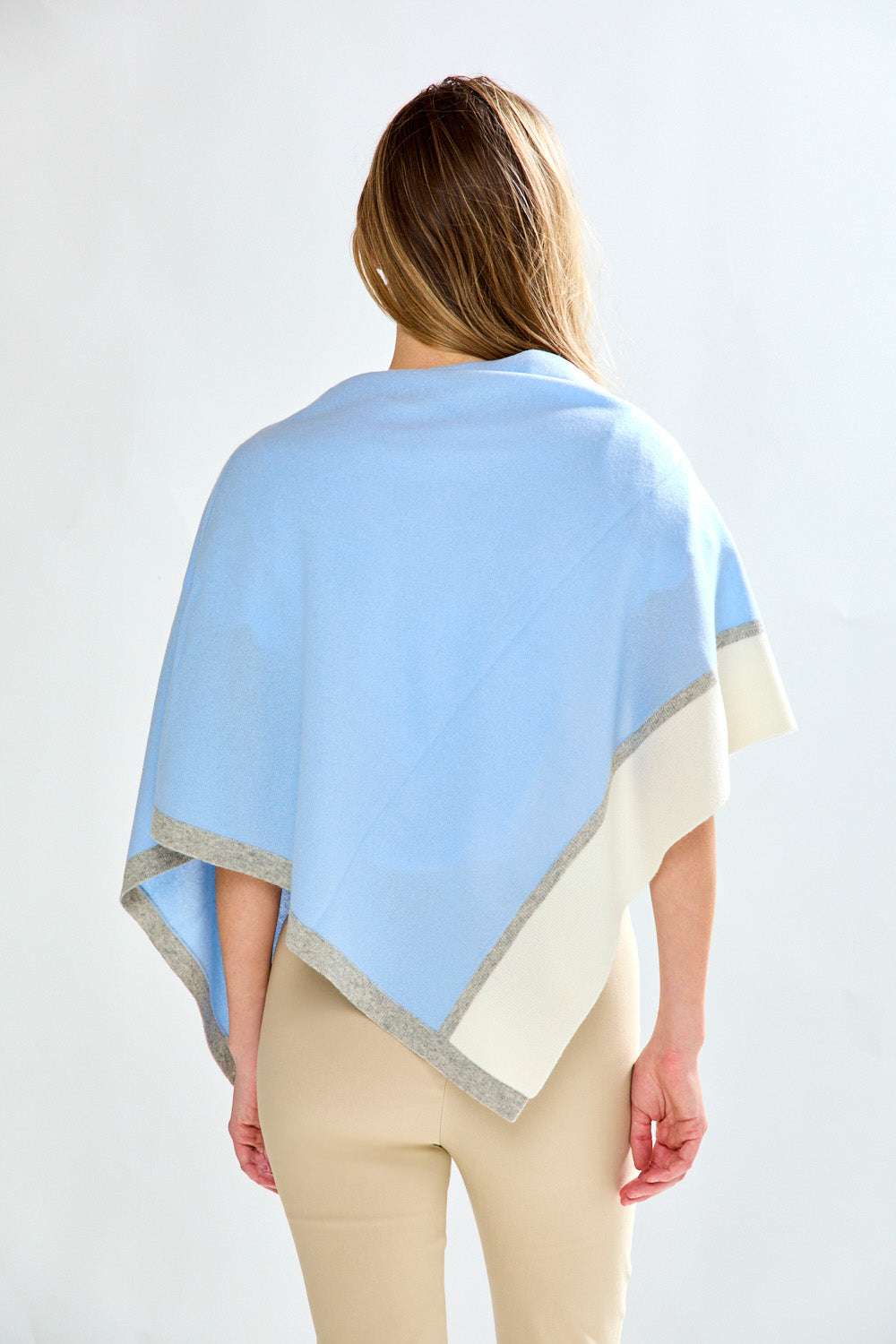 Woman in artic tipped poncho