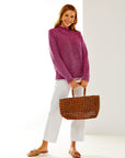 Woman in boysenberry sweater