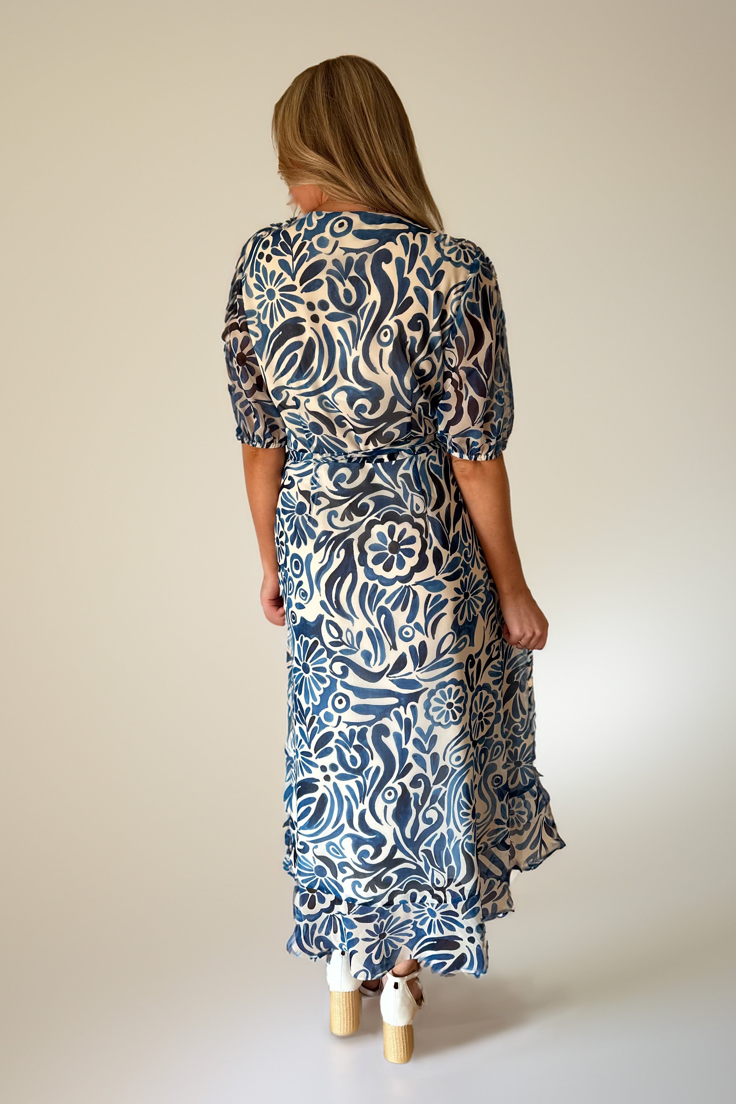 Woman in paisley print dress