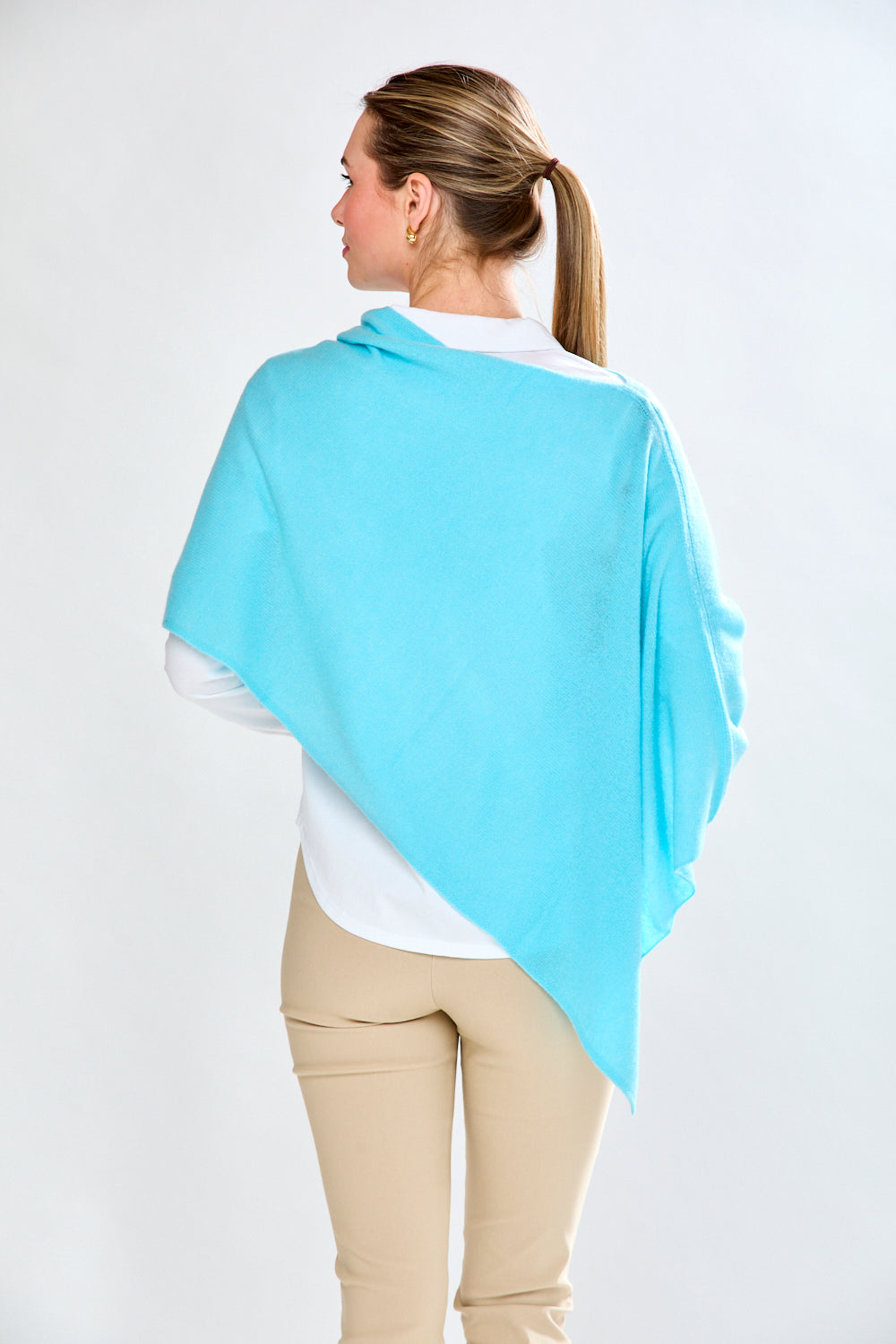 woman in light aqua wrap