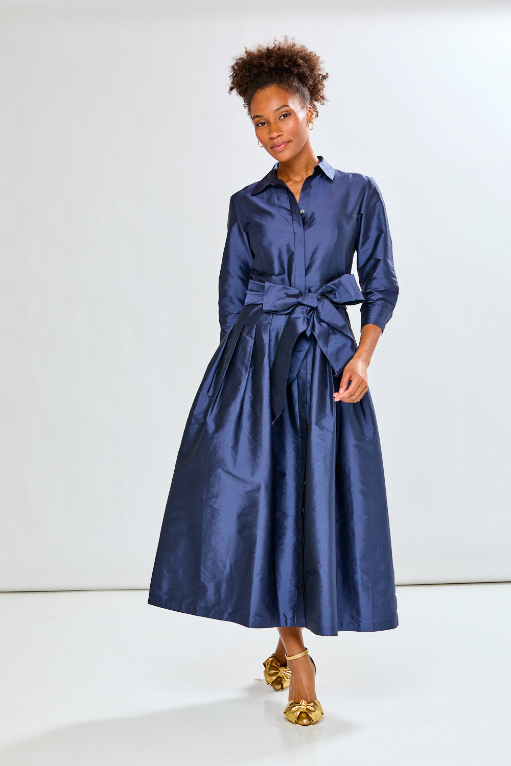 Woman in navy long taffeta dress