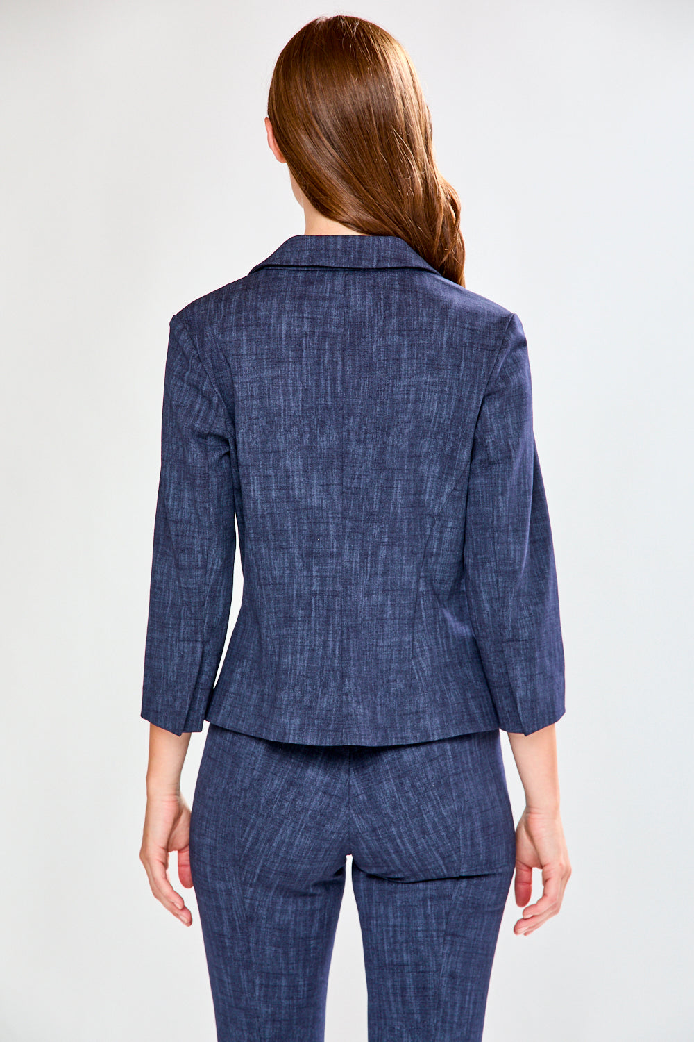 Woman wearing a blue suit on a white background