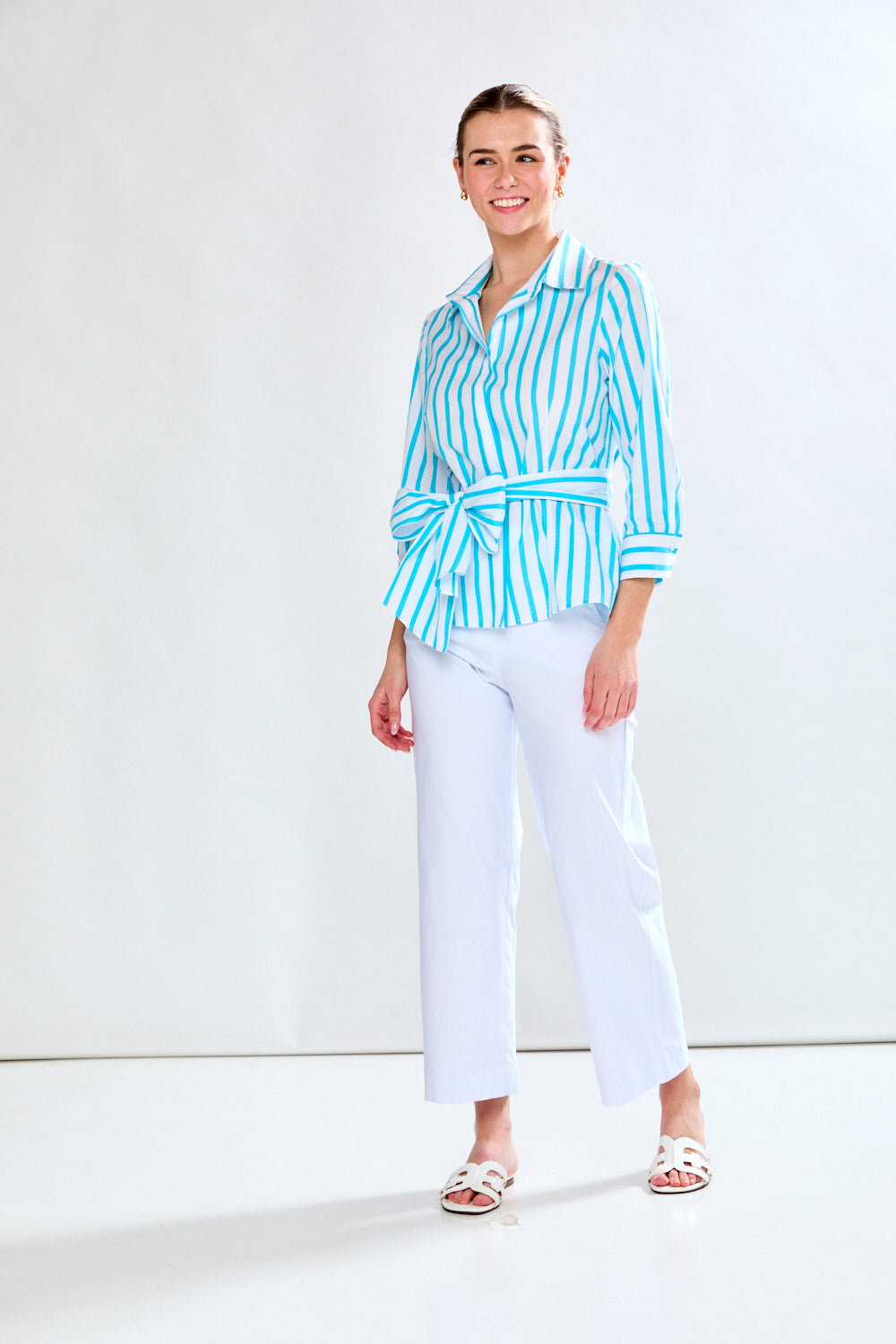 Woman in aqua and white stripe top