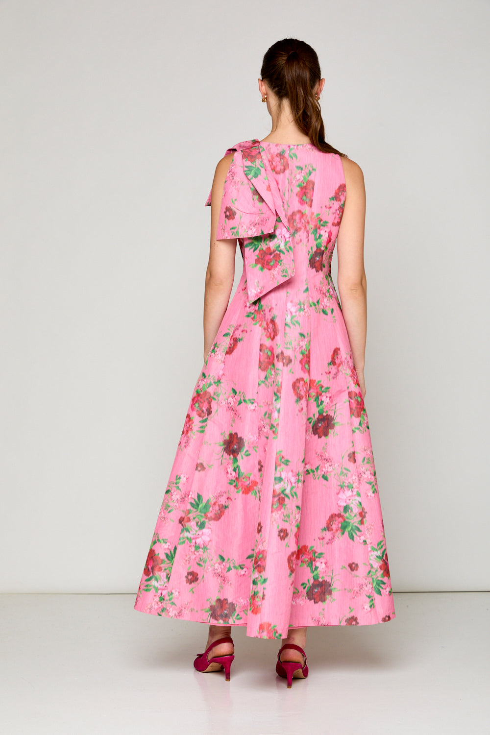 Woman in pink floral dress