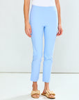 Light blue pants worn by a person on a white background