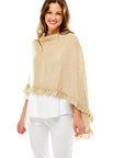 Woman in sand poncho