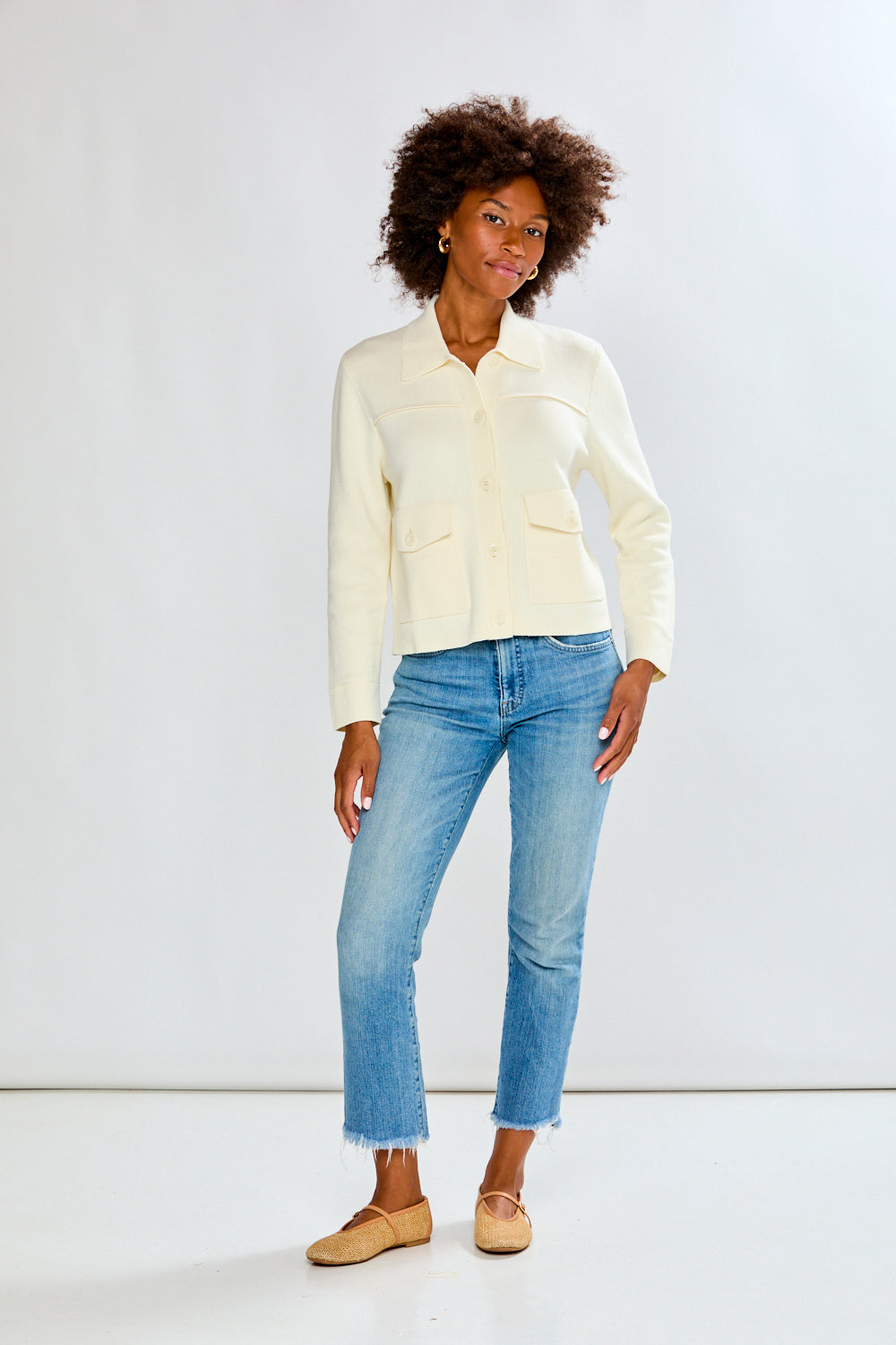 Woman in ivory sweater jacket