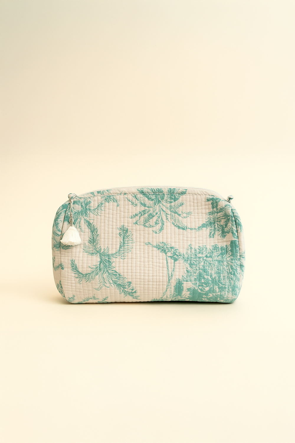 Fabric pouch with green floral pattern on a beige background