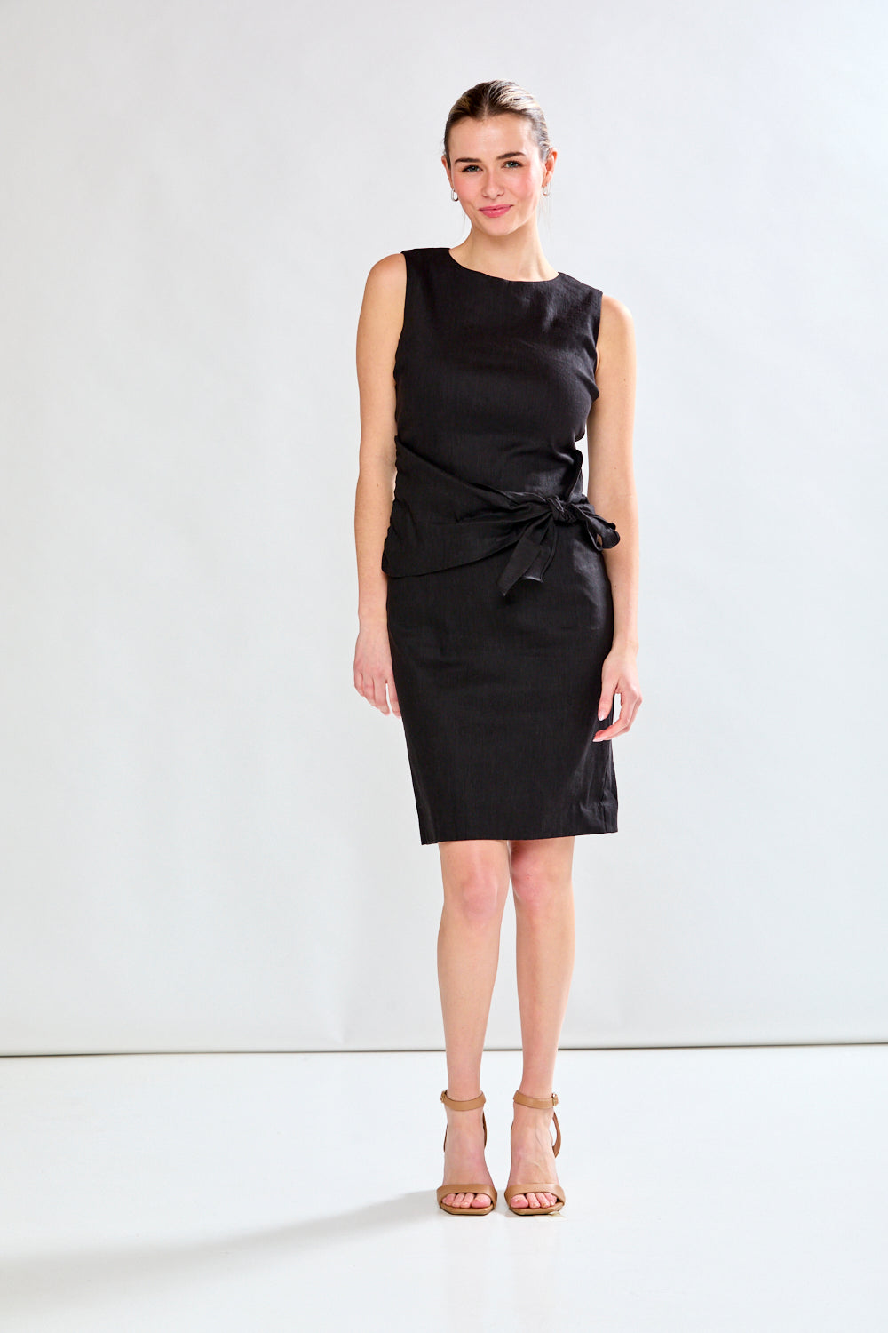 Woman in black sleeveless dress