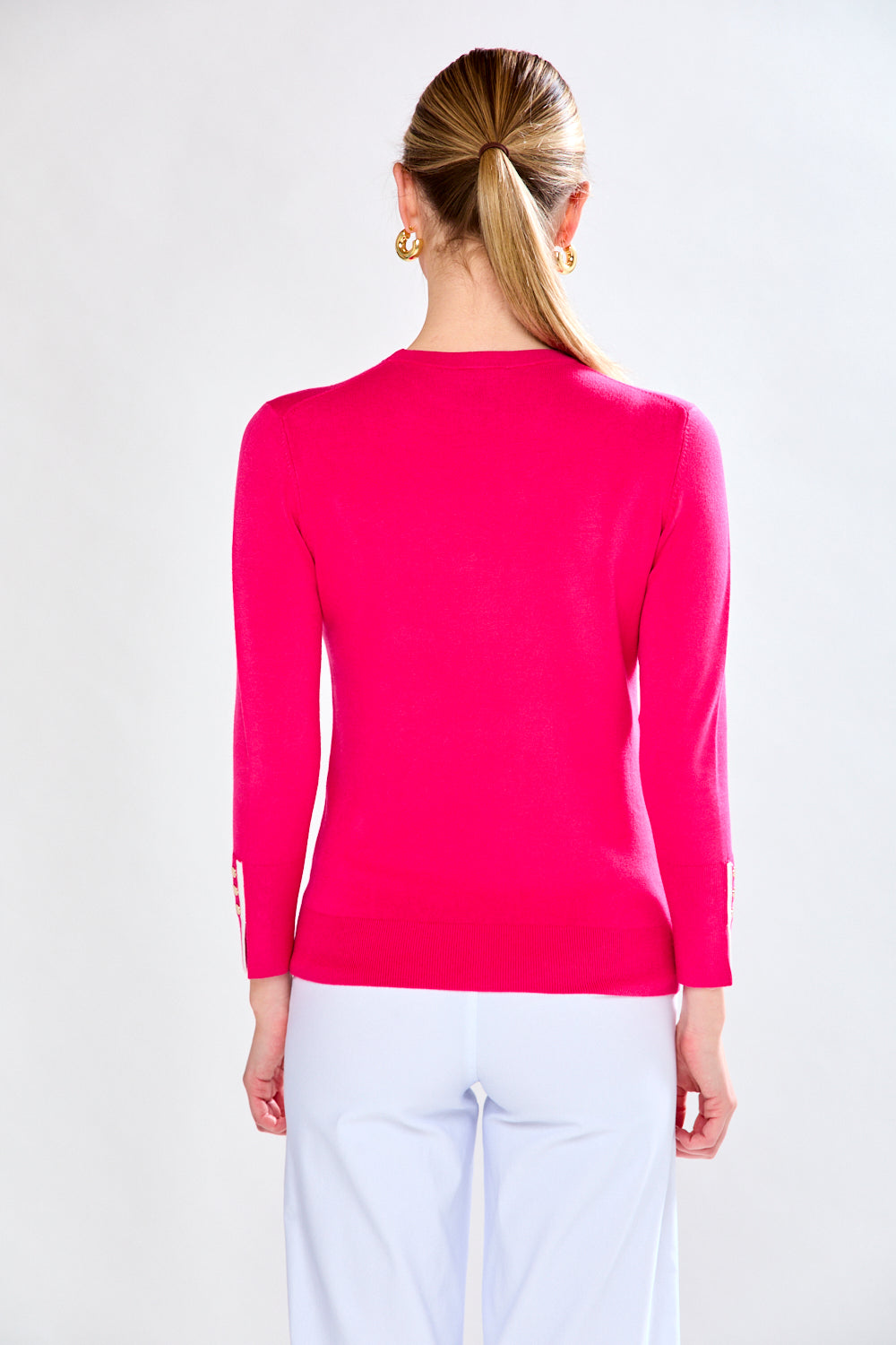 Woman in pink/white sweater