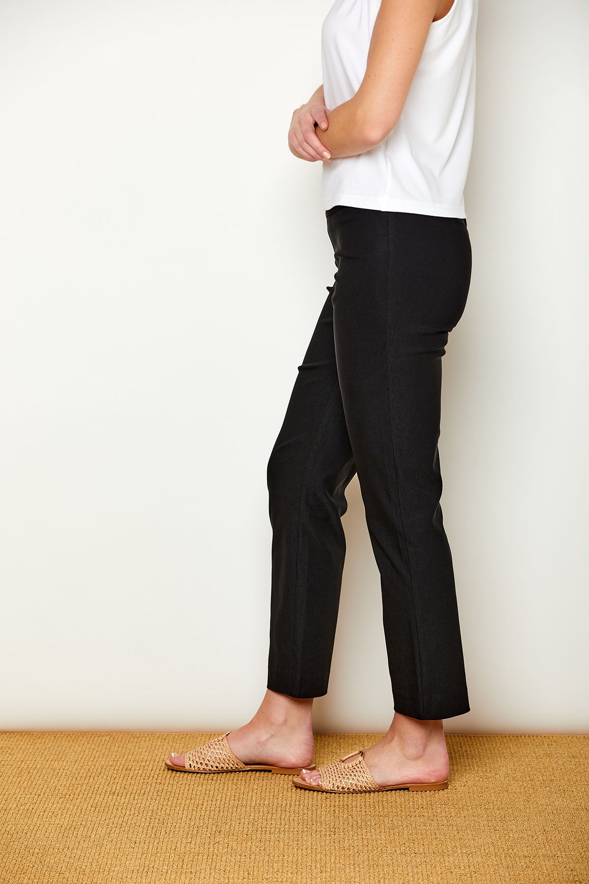 Woman in fitted black colored pants