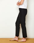 Woman in fitted black colored pants