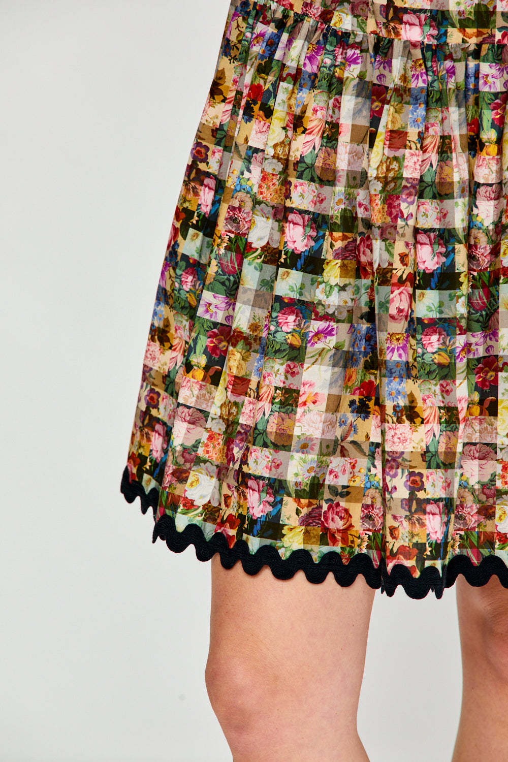 Woman in floral gingham dress