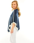 Woman in navy poncho