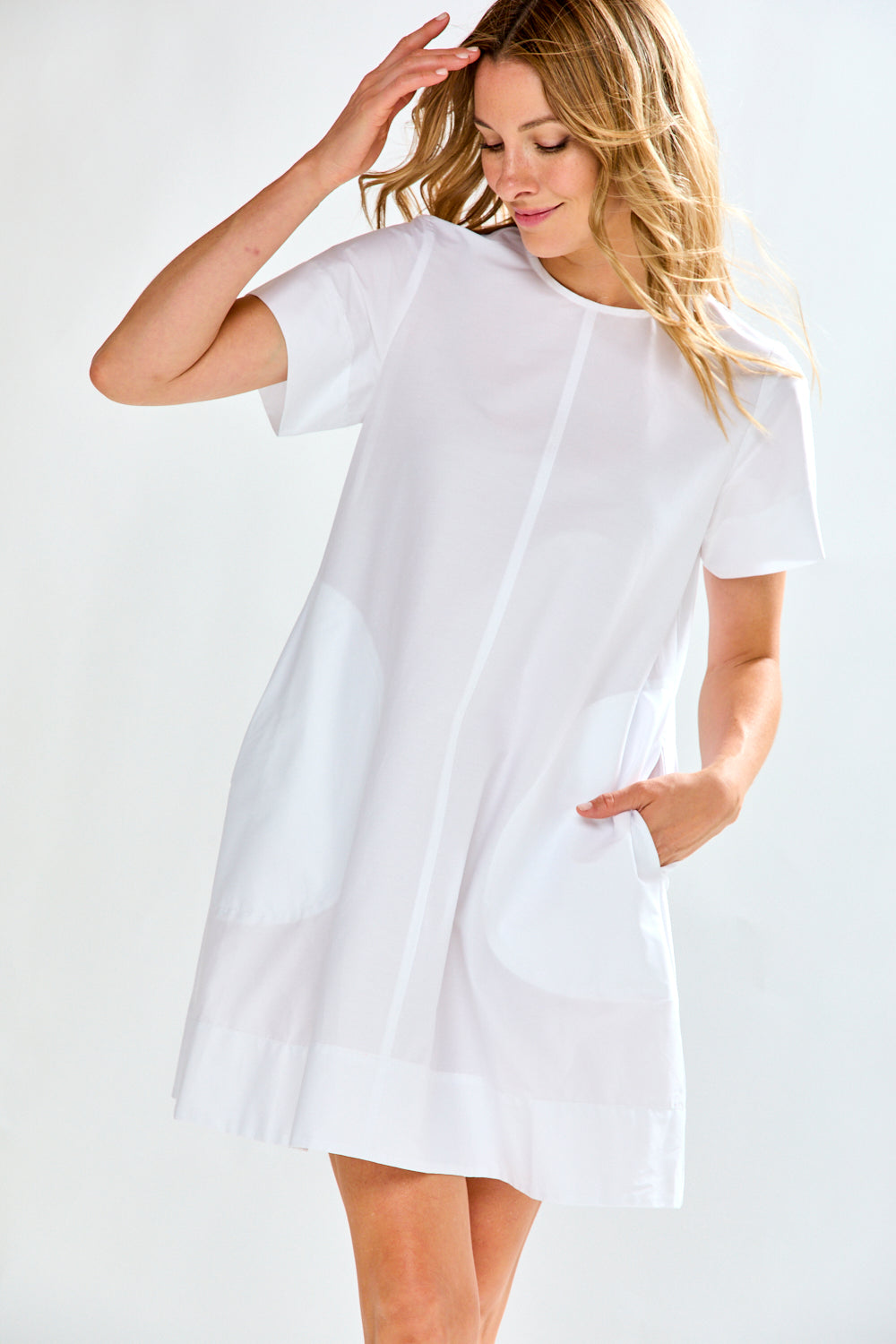 Woman in white poplin short dress