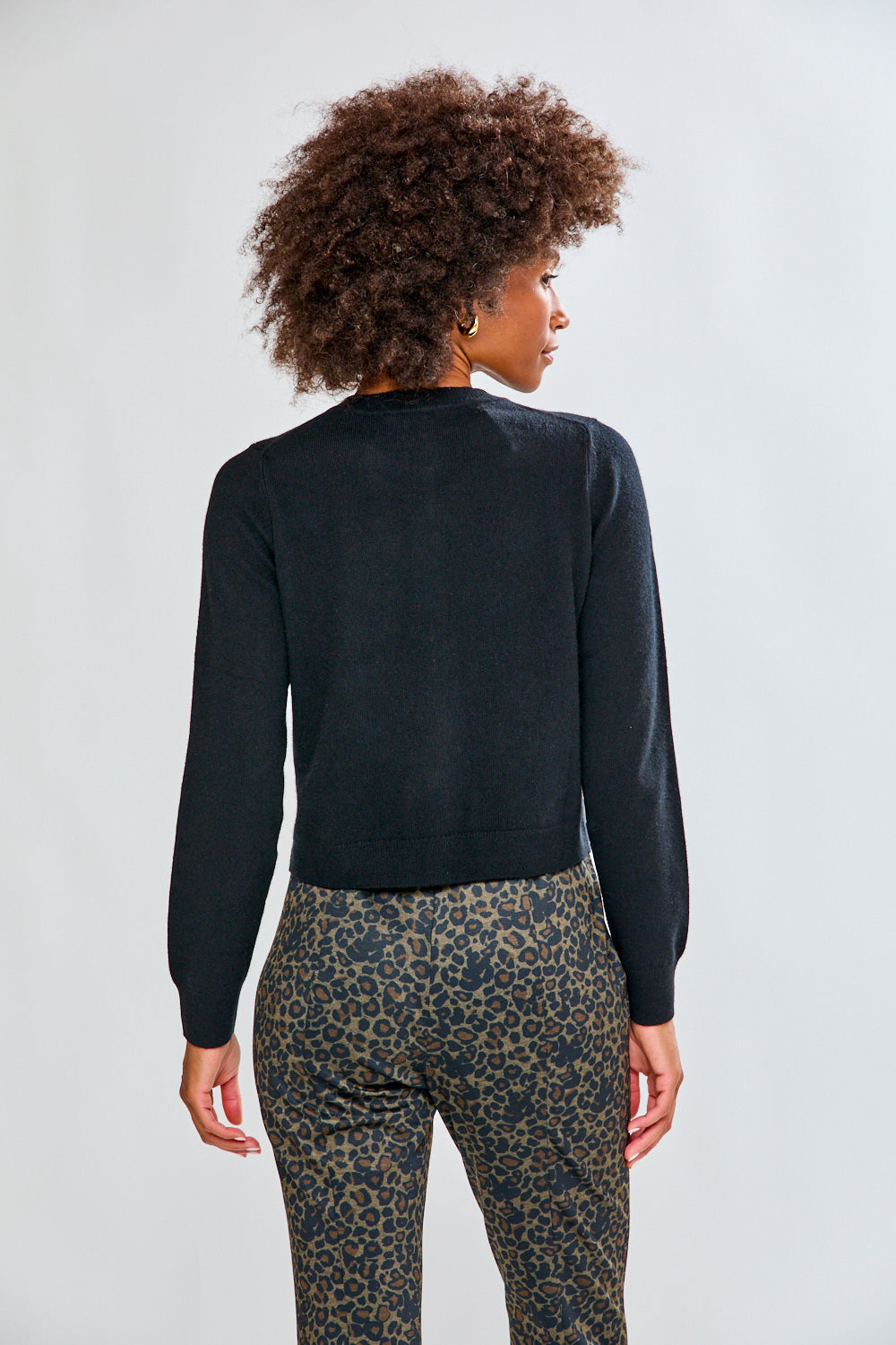 Woman in black cashmere sweater