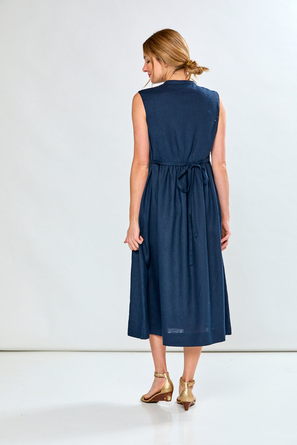 Woman in navy tea length dress