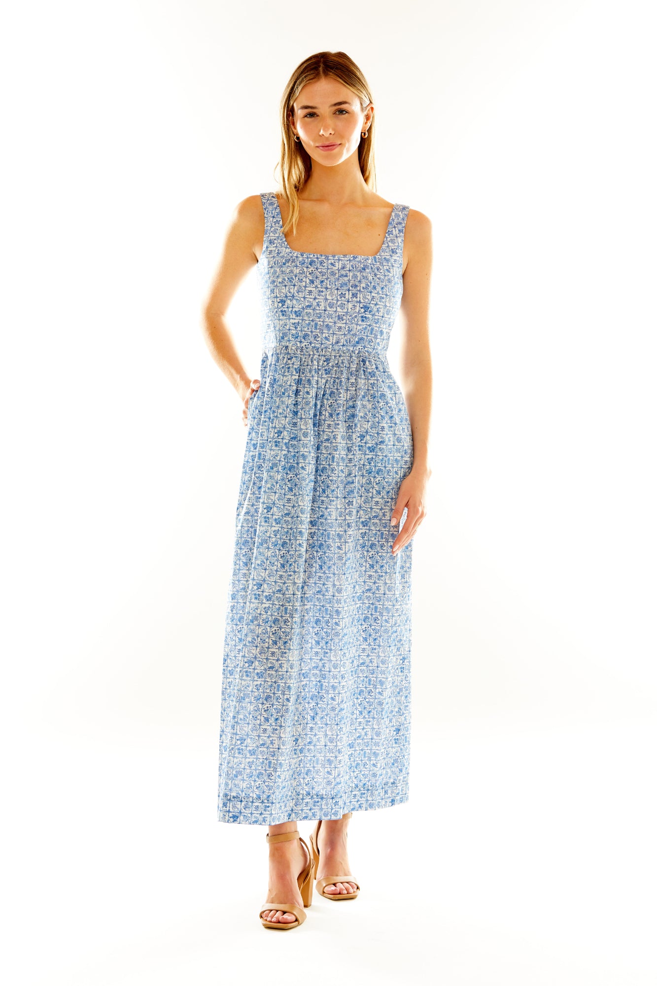 Woman in blue floral maxi dress