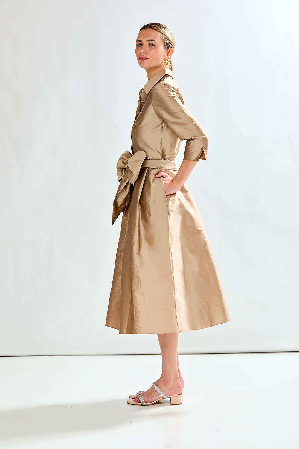 Woman in mocha taffeta dress