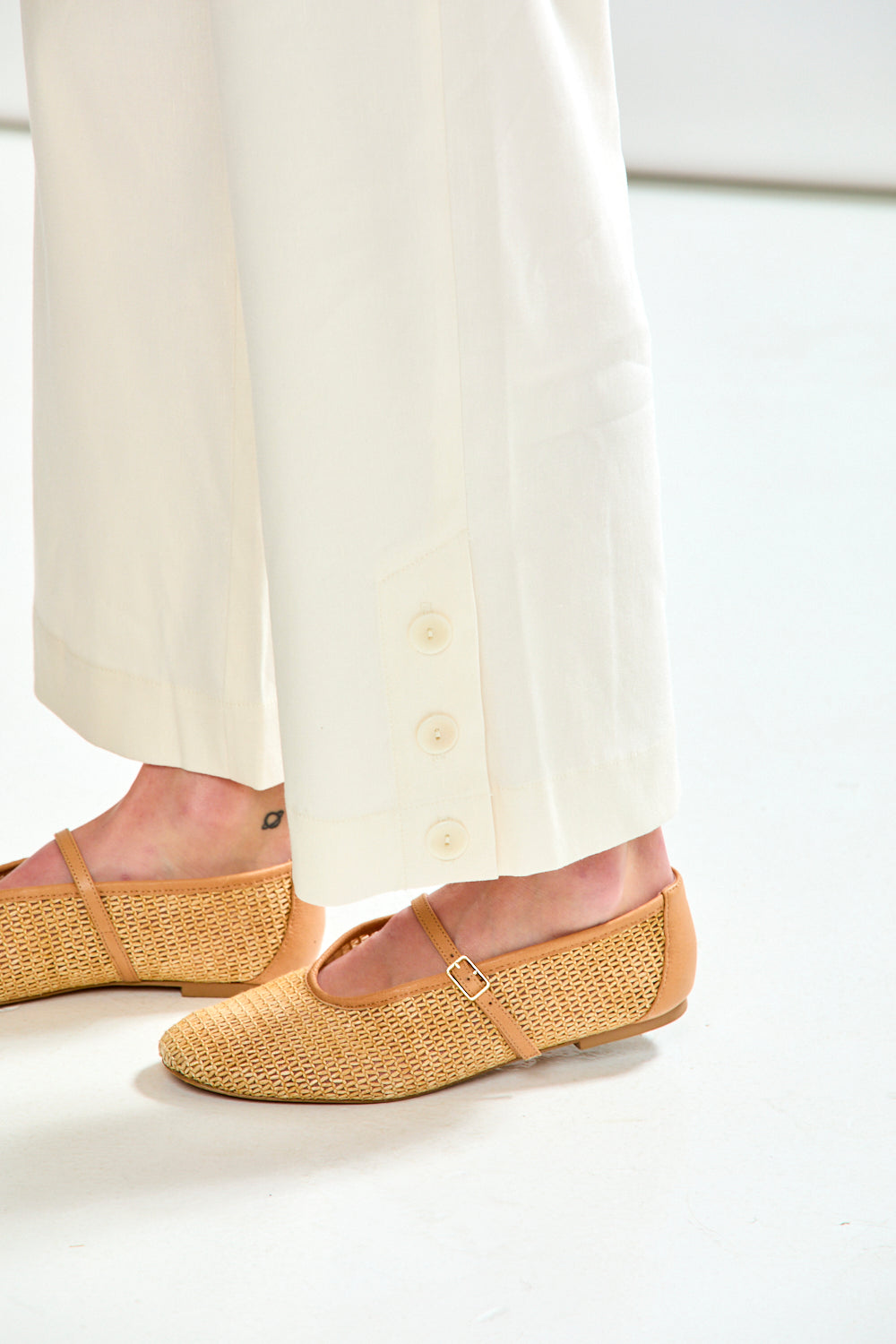 Woman in oyster pant