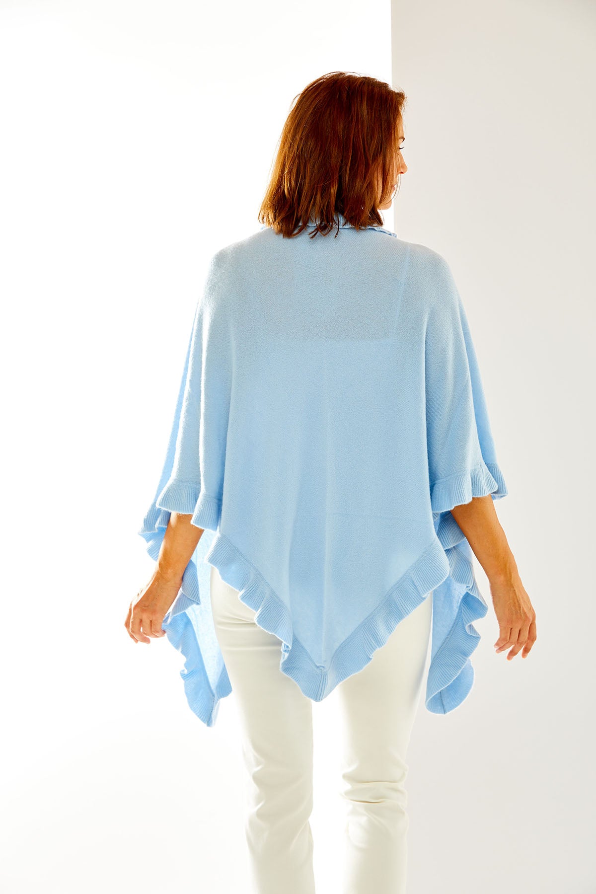 Arctic cashmere wrap with ruffle edge. Perfect for everyday wear and as a cocktail attire accessory