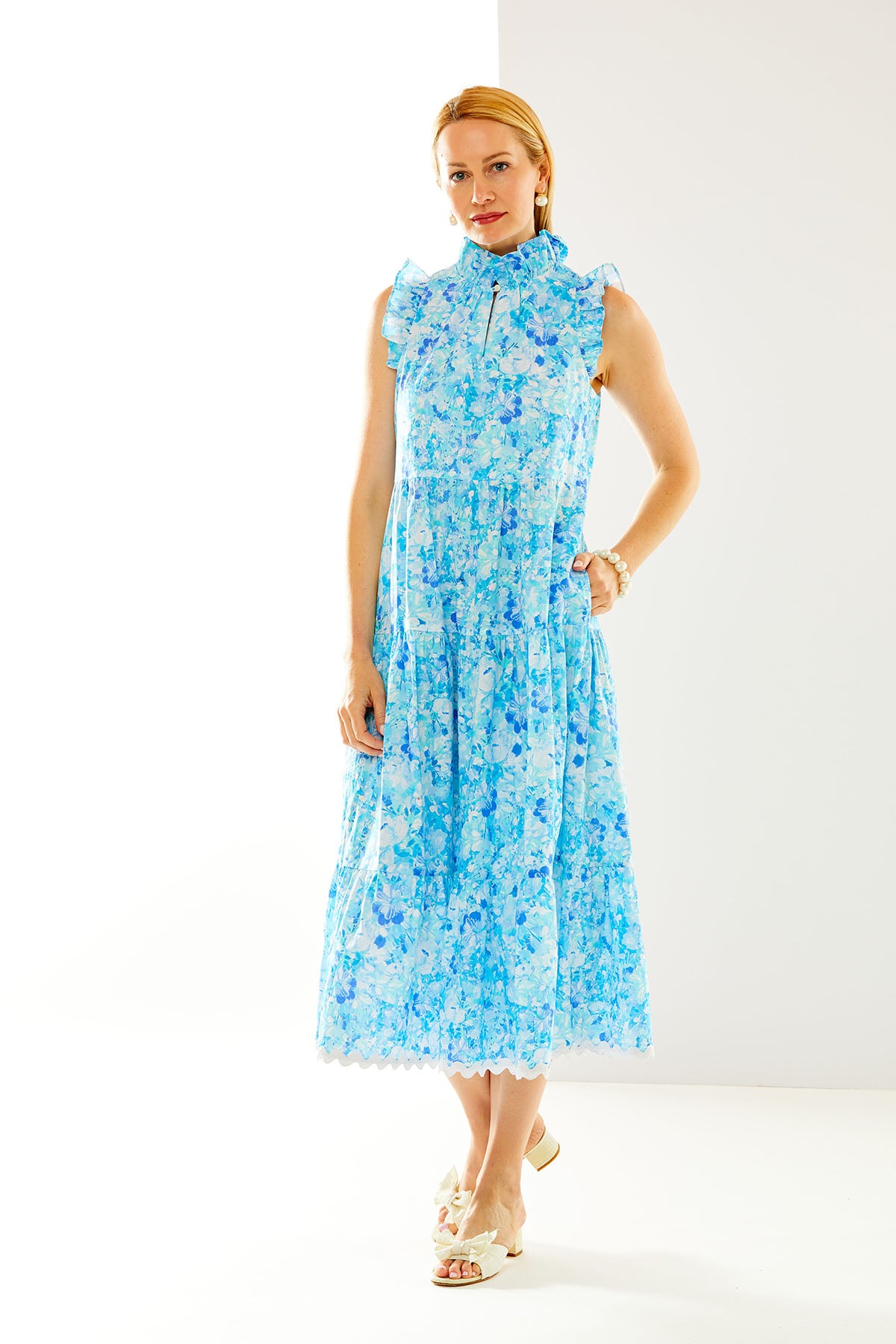 Woman in blue floral maxi dress