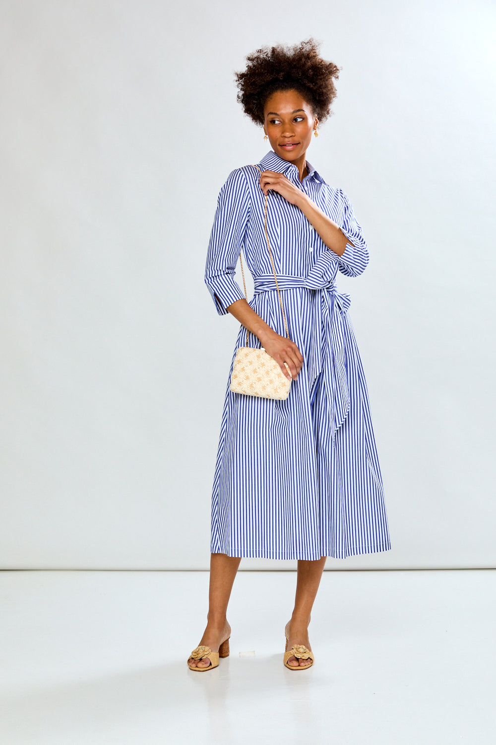 Woman in blue stripe dress