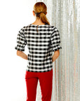 Woman in check silk dupioni top