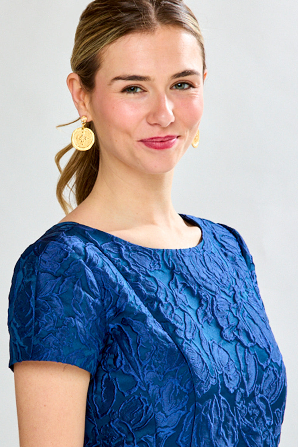 Woman in navy tea length dress