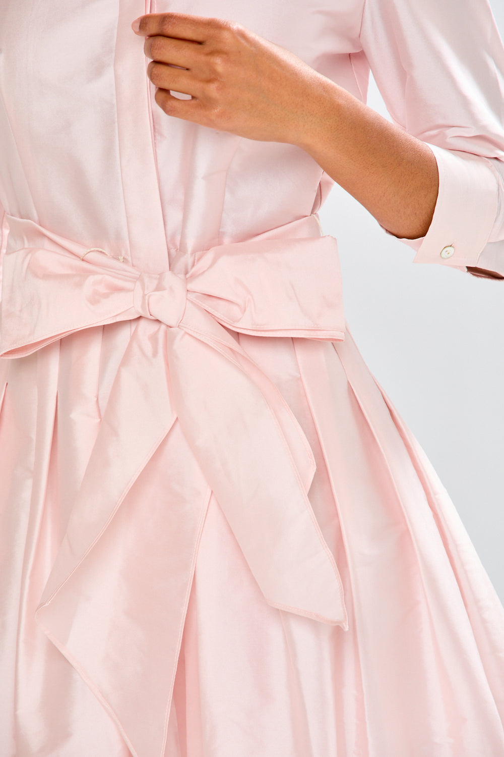 Woman in blush pink long taffeta dress