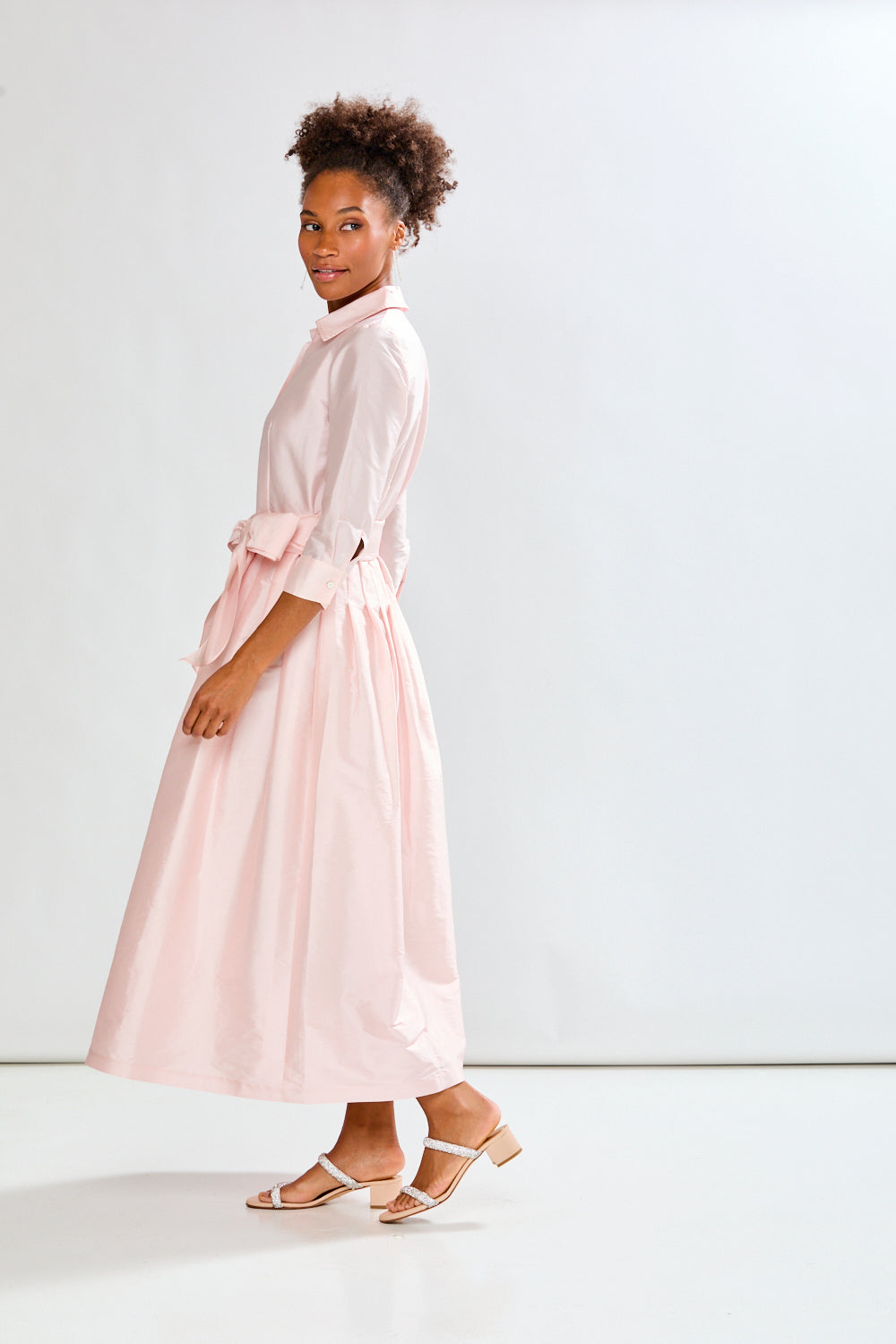 Woman in blush pink long taffeta dress