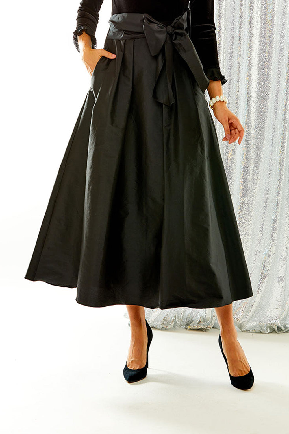 Woman wearing black taffeta skirt