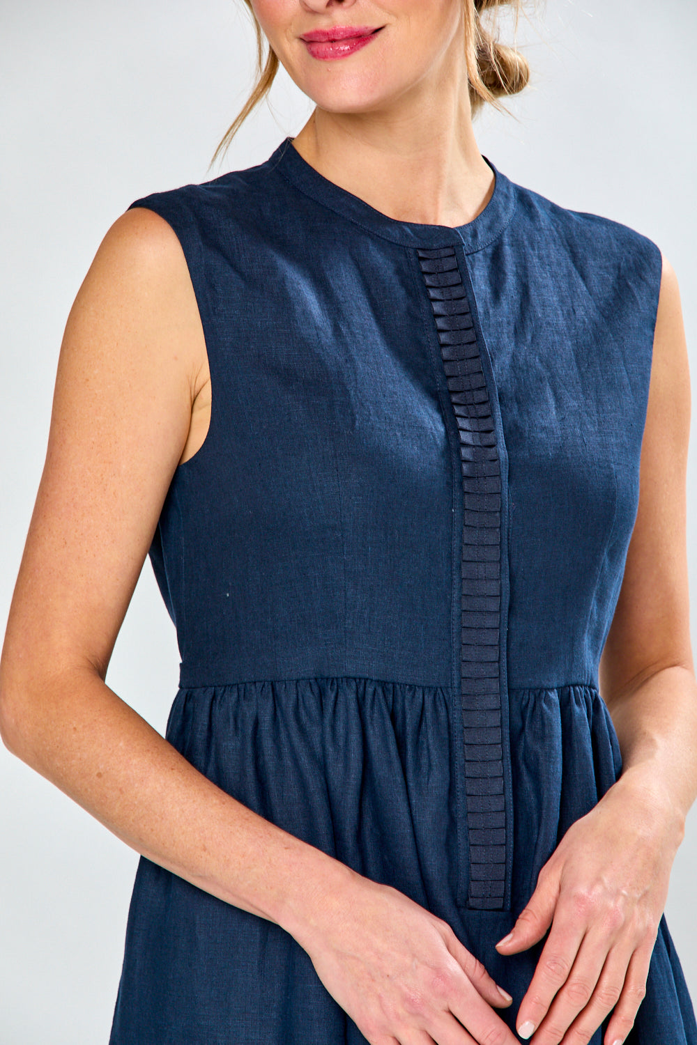 Woman in navy tea length dress