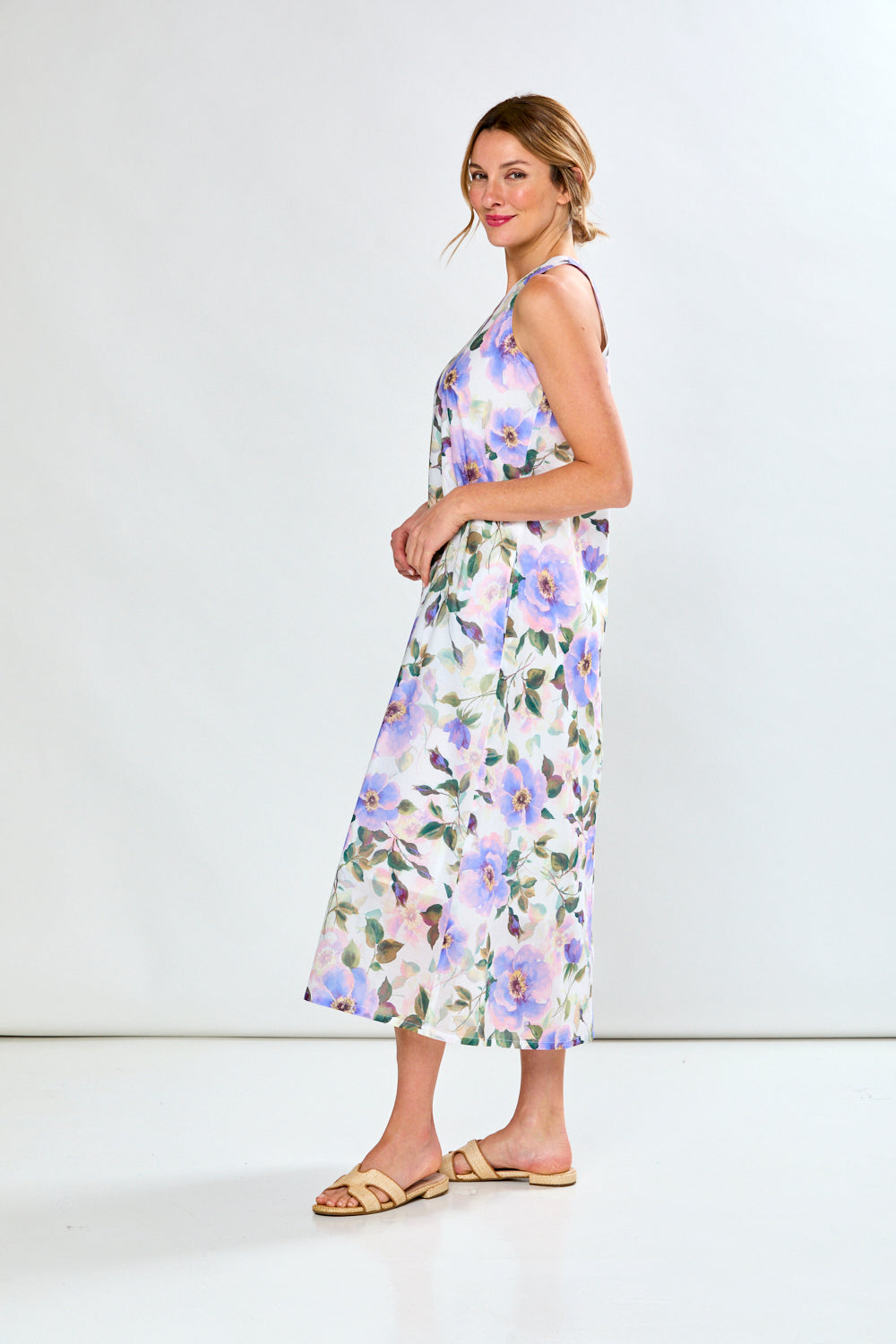 Woman in violet poppies dress