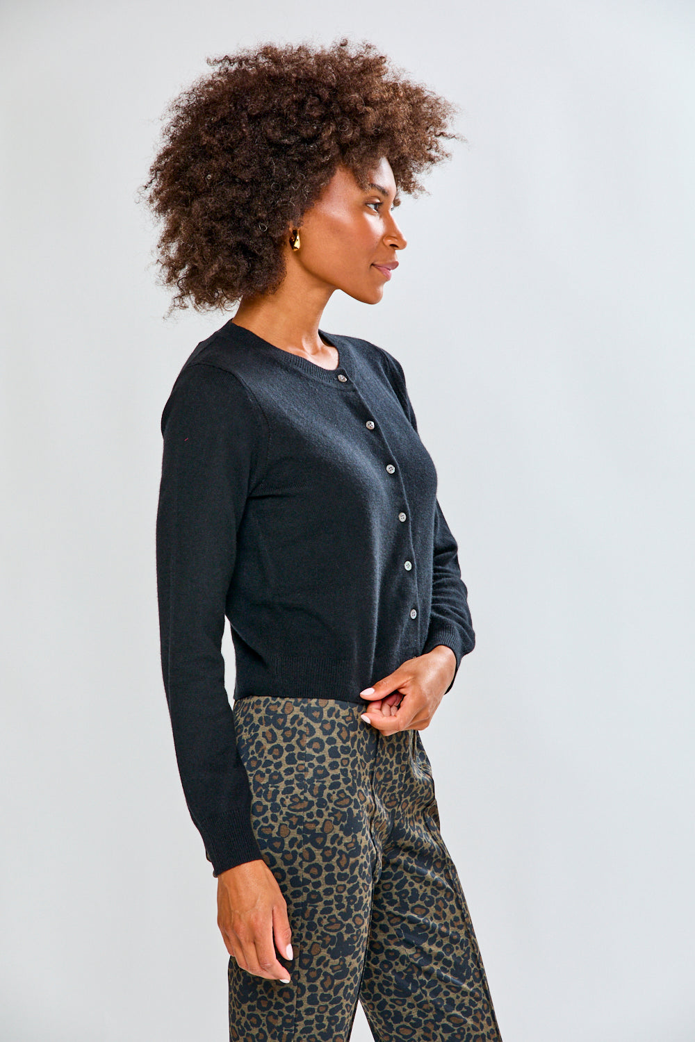 Woman in black cashmere sweater