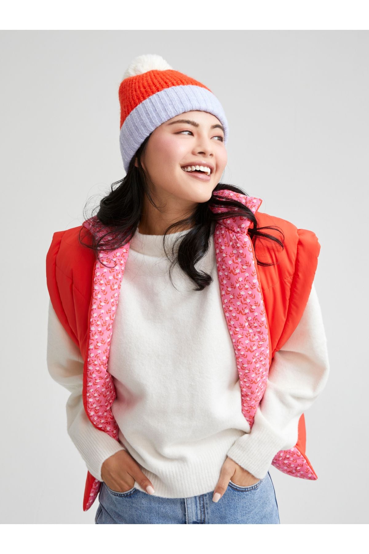 Woman in orange ribbed hat