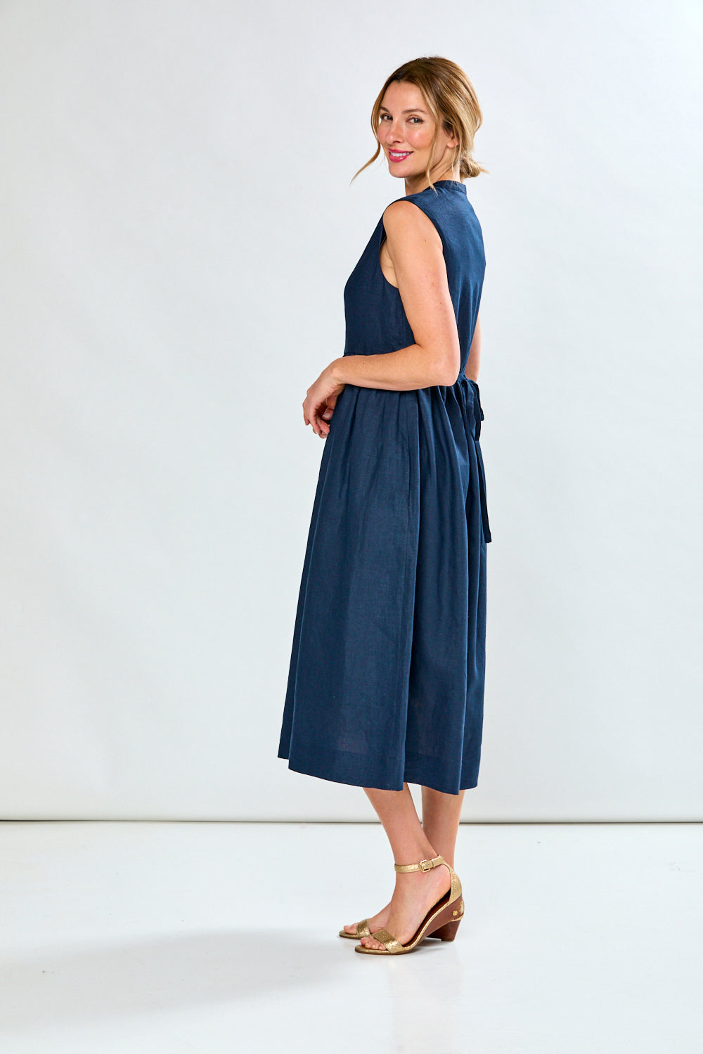 Woman in navy tea length dress