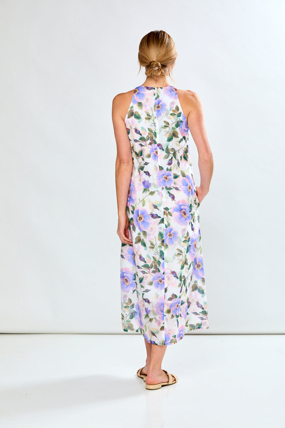 Woman in violet poppies dress