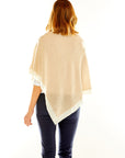 Woman in sand poncho