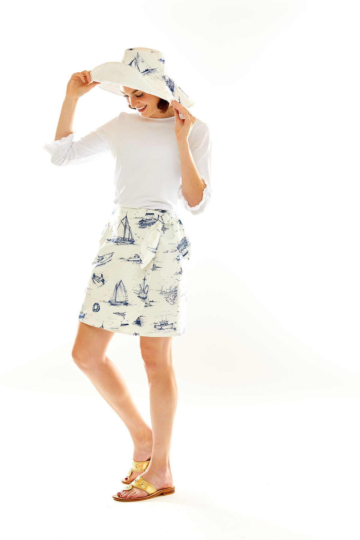 Woman in blue nautical toile hat