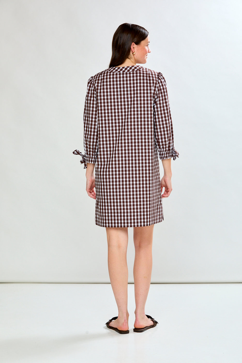 Woman in check dress
