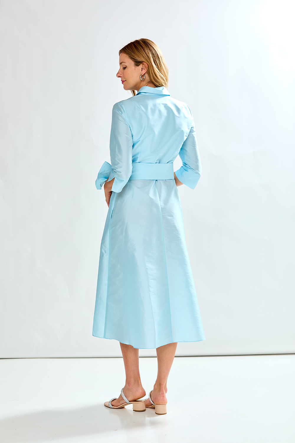 Woman in french blue taffeta dress