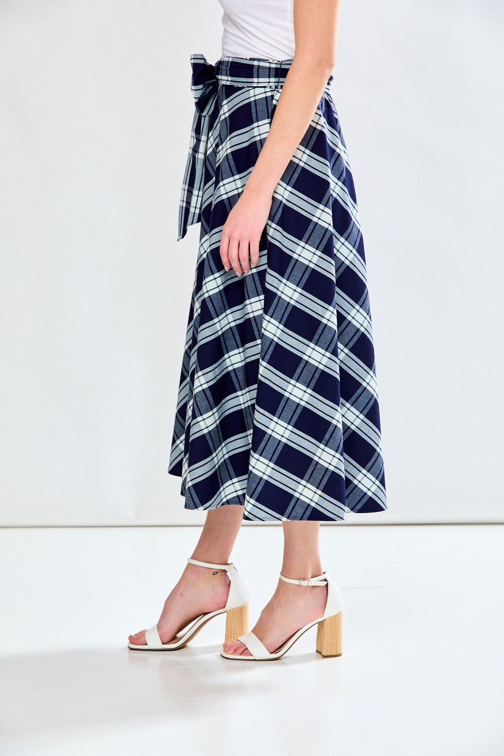 Woman in plaid skirt