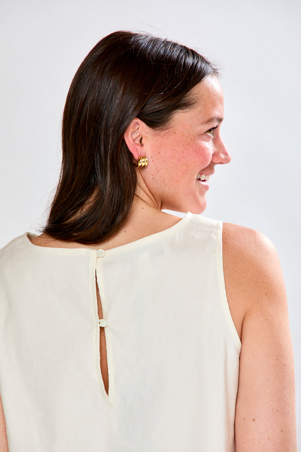 Woman in white top