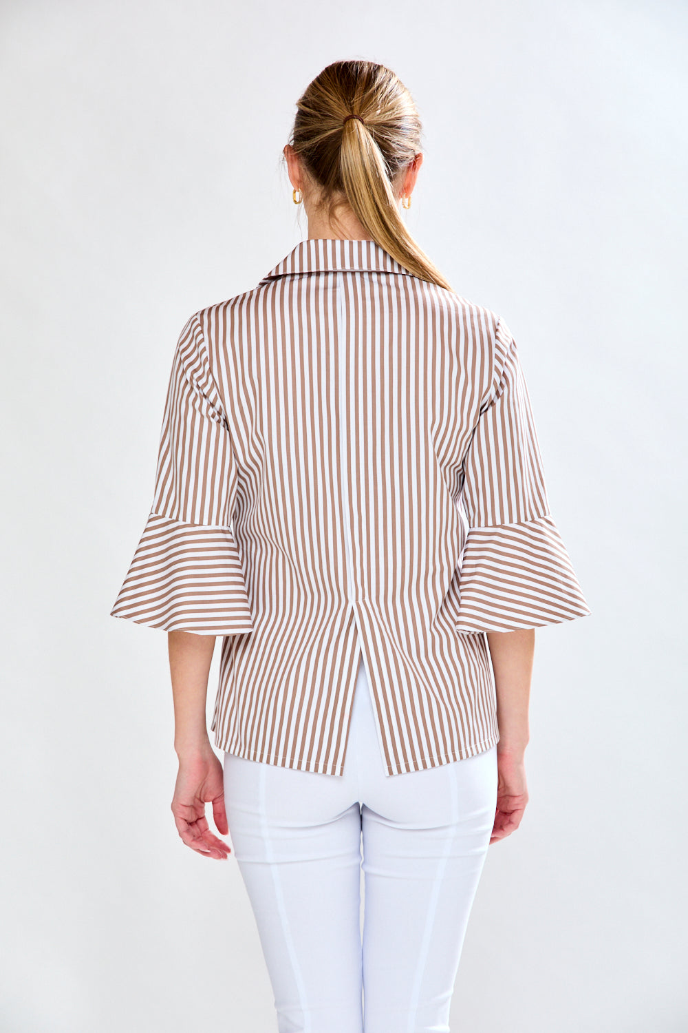 Woman in mocha and white striped top