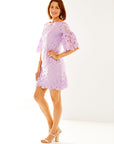 Woman in lilac lace dress