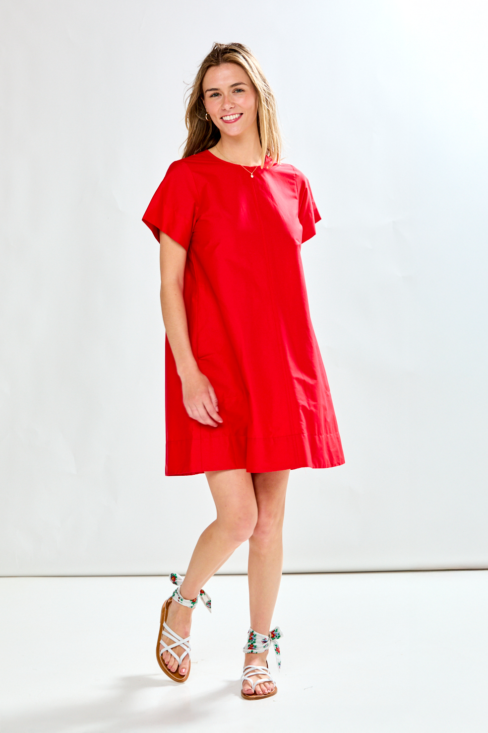 Woman in red poplin short dress