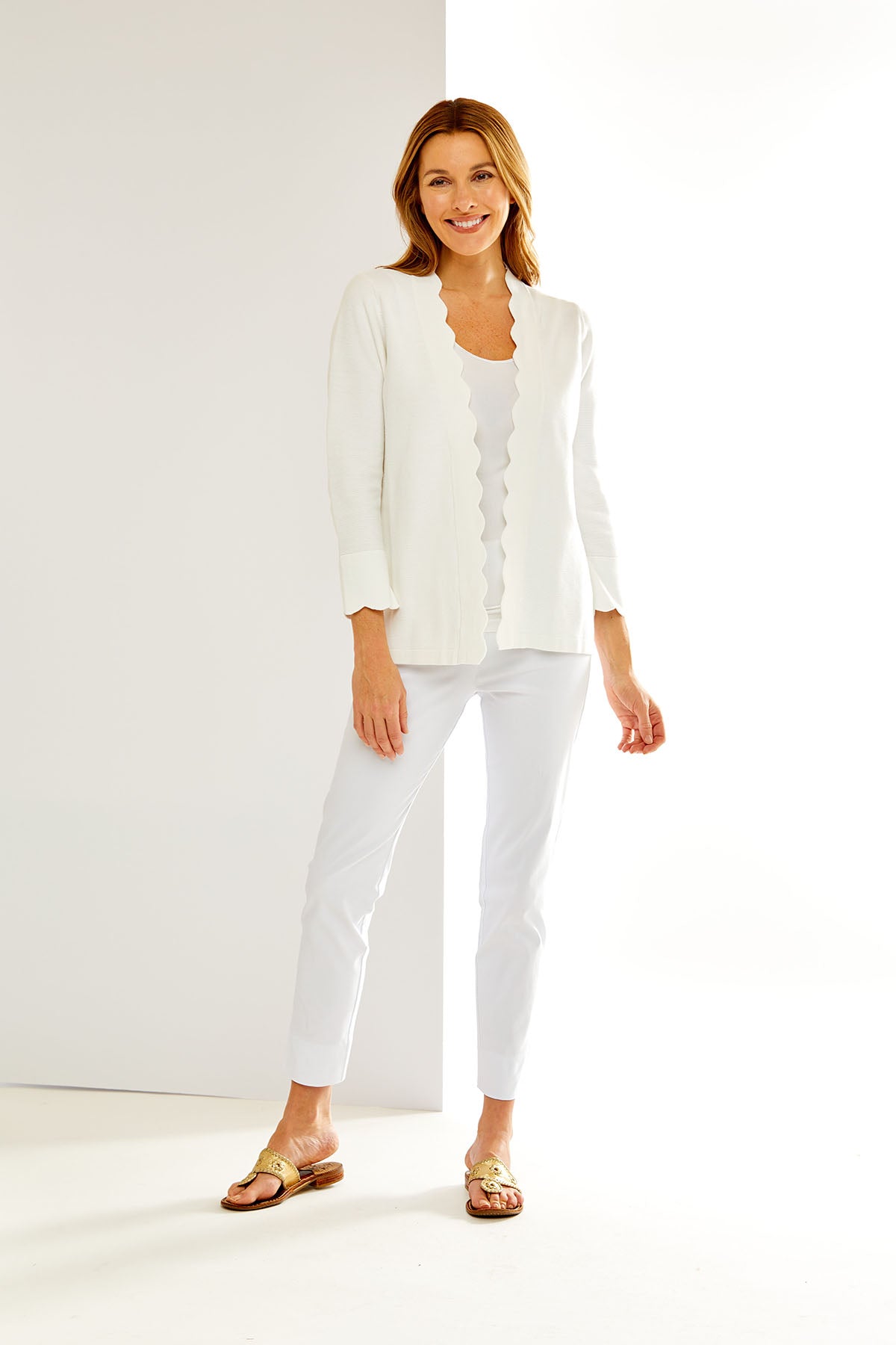 Woman in white scallop cardigan