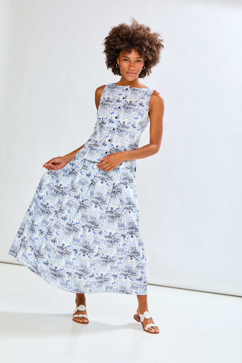 Woman wearing a blue patterned skirt and matching top