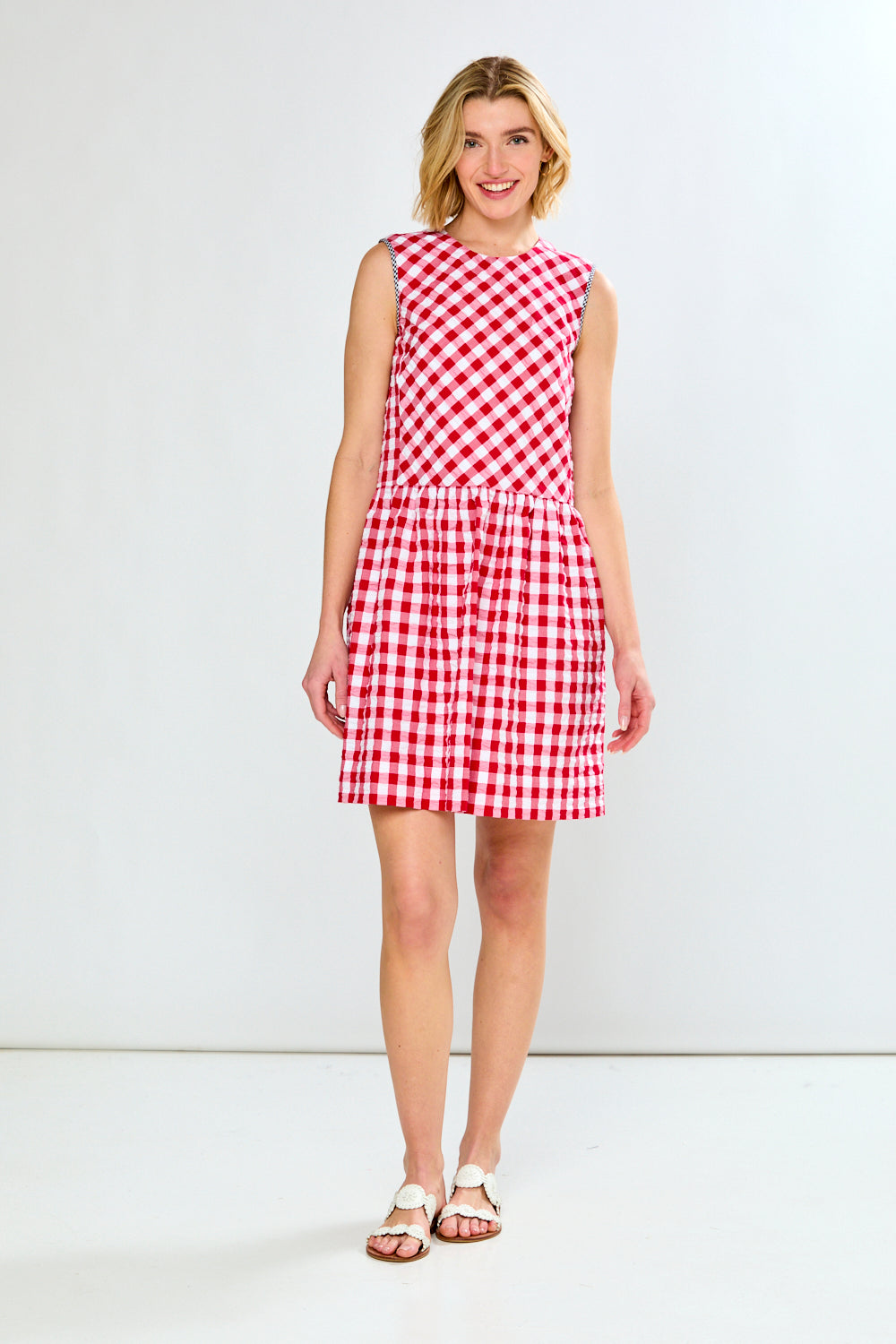 woman in red check dress